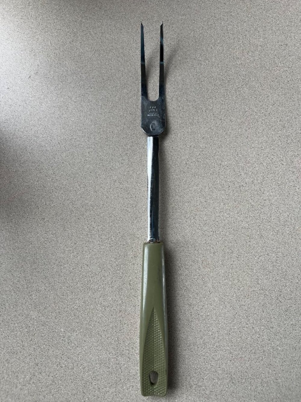 Ekco Avocado Green Handled Meat Fork, discoloration handled back